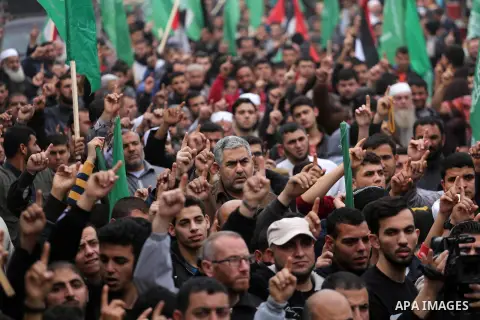 Palestinian supporters Hamas movement take part during a protest against U.S. President Donald Trump's decision to recognise Jerusalem as the capital of Israel, in Jabalia refugee camp in the northern Gaza strip on Decem...
