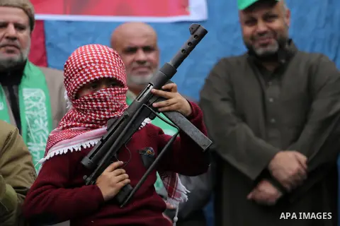 Palestinian supporters Hamas movement take part during a protest against U.S. President Donald Trump's decision to recognise Jerusalem as the capital of Israel, in Jabalia refugee camp in the northern Gaza strip on Decem...