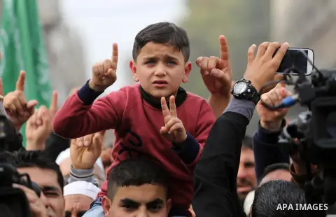 Palestinian supporters Hamas movement take part during a protest against U.S. President Donald Trump's decision to recognise Jerusalem as the capital of Israel, in Jabalia refugee camp in the northern Gaza strip on Decem...