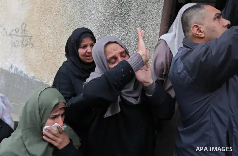 Palestinian relatives of Mohamed Moheisen, 29, who was killed during clashes with Israeli troops, mourn during his funeral in Gaza city on December 23, 2017. Two Palestinians were killed as youths clashed with Israeli so...
