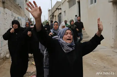 Palestinian relatives of Mohamed Moheisen, 29, who was killed during clashes with Israeli troops, mourn during his funeral in Gaza city on December 23, 2017. Two Palestinians were killed as youths clashed with Israeli so...