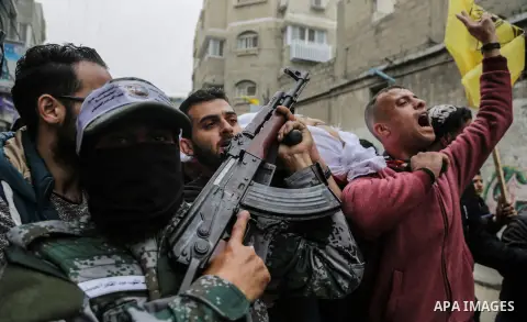 Palestinian mourners carry the body of Mohamed Moheisen, 29, who was killed during clashes with Israeli troops, during his funeral in Gaza city on December 23, 2017. Two Palestinians were killed as youths clashed with Is...