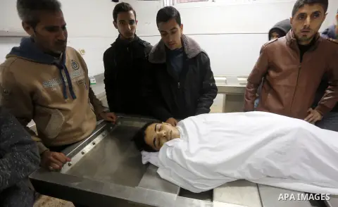 Relatives mourn over the body of Palestinian Mohammed Al- Dahdouh who was shot dead during clashes with Israeli troops, at a hospital morgue in Gaza city December 24, 2017. Al- Dahdouh who was shot during clashes with th...
