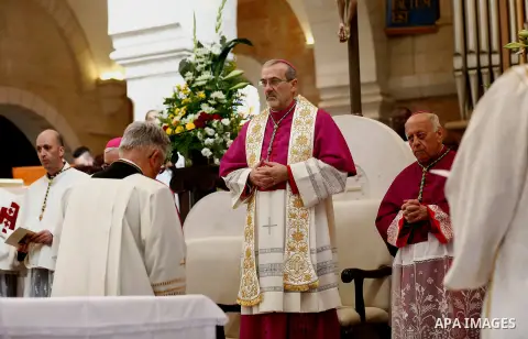 Archbishop Pierbattista Pizzaballa, Apostolic Administrator of the Latin Patriarchate of Jerusalem attends a mass inside the Church of the Nativity in the West Bank city of Bethlehem on December 24, 2017. Photo by Wisam...