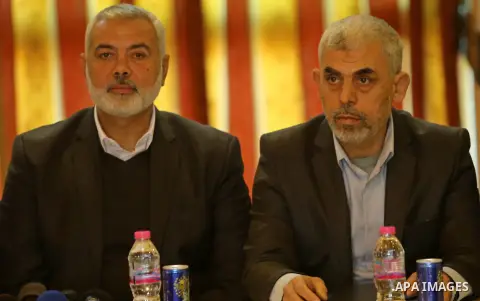 Hamas leader Ismail Haniya and Hamas's leader in the Gaza Strip Yahya Sinwar attend a meeting with heads of Palestinian families in Gaza city on December 26, 2017. Photo by Ashraf Amra