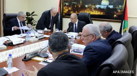 Palestinian Prime Minister, Rami Hamdallah, chairs a meeting of of council of Ministers in the West Bank city of Ramallah on December 27, 2017. Photo by Prime Minister Office
