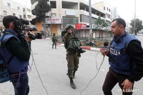 Palestinian photographers scuffles with Israeli security forces in the occupied West Bank city of Hebron on December 29, 2017 as protests continue over US President Donald Trump's declaration of Jerusalem as Israel's cap...