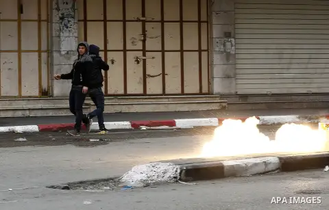 Palestinian demonstrators clash with Israeli security forces in the occupied West Bank city of Hebron on December 29, 2017 as protests continue over US President Donald Trump's declaration of Jerusalem as Israel's capita...