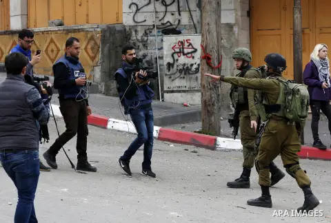 Israeli security forces take position during clashes with Palestinian protesters in the occupied West Bank city of Hebron on December 29, 2017 as protests continue over US President Donald Trump's declaration of Jerusale...