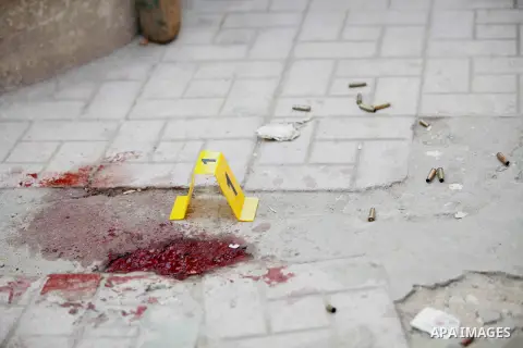 A close up shot shows Egyptian forensic policemen inspecting the site of a gun attack on Mar Mina church in Helwan district on the outskirts of Cairo, on December 29, 2017. A gunman opened fire on a church, killing at le...