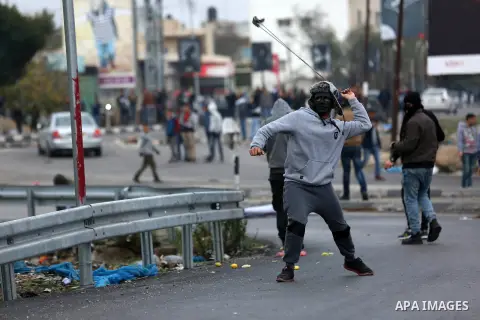 Palestinian protesters clash with Israeli security forces as protests continue over US President Donald Trump's declaration of Jerusalem as Israel's capital at Hawara checkpoint, south of the West Bank city of Nablus on...