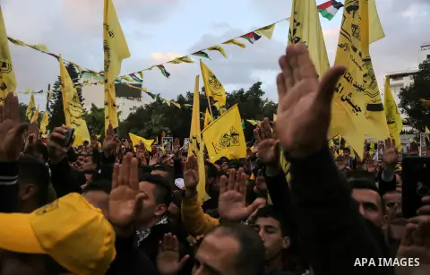 Palestinian supporters of the Fatah movement take part during a rally in Gaza City on December 31, 2017, marking the 53rd anniversary of the creation of the political party. Photo by Mohammed Dahman