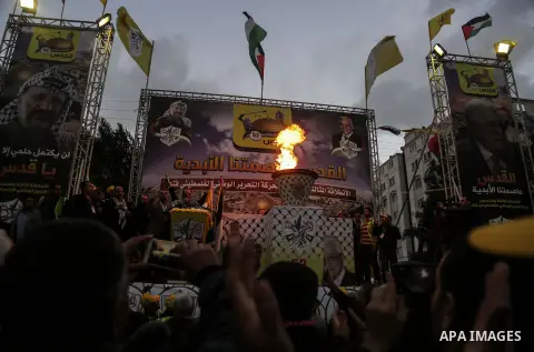 Palestinian supporters of the Fatah movement take part during a rally in Gaza City on December 31, 2017, marking the 53rd anniversary of the creation of the political party. Photo by Mohammed Dahman