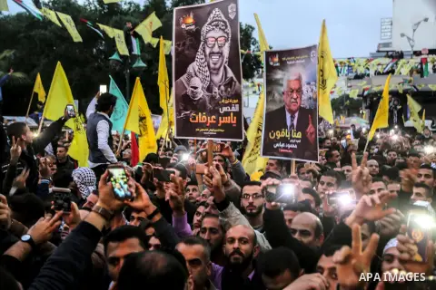 Palestinian supporters of the Fatah movement take part during a rally in Gaza City on December 31, 2017, marking the 53rd anniversary of the creation of the political party. Photo by Mohammed Dahman