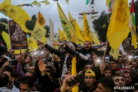 Palestinian supporters of the Fatah movement take part during a rally in Gaza City on December 31, 2017, marking the 53rd anniversary of the creation of the political party. Photo by Mohammed Dahman