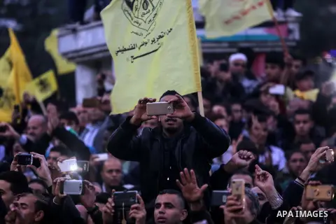 Palestinian supporters of the Fatah movement take part during a rally in Gaza City on December 31, 2017, marking the 53rd anniversary of the creation of the political party. Photo by Mohammed Dahman