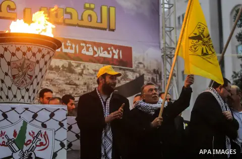 Palestinian supporters of the Fatah movement take part during a rally in Gaza City on December 31, 2017, marking the 53rd anniversary of the creation of the political party. Photo by Mohammed Dahman