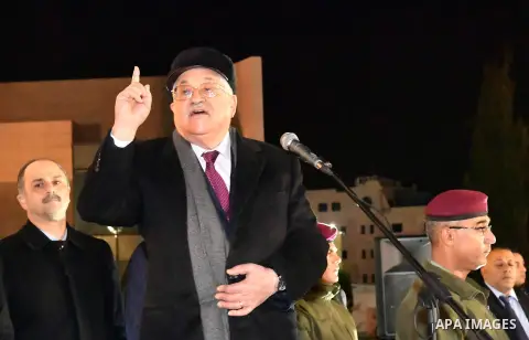 Palestinian president Mahmud Abbas speaks outside the tomb of the late President Yasser Arafat during a celebration marking the fifty-third anniversary of the creation of the Fatah movement in the West Bank city of Ramal...