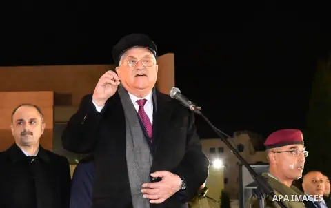 Palestinian president Mahmud Abbas speaks outside the tomb of the late President Yasser Arafat during a celebration marking the fifty-third anniversary of the creation of the Fatah movement in the West Bank city of Ramal...