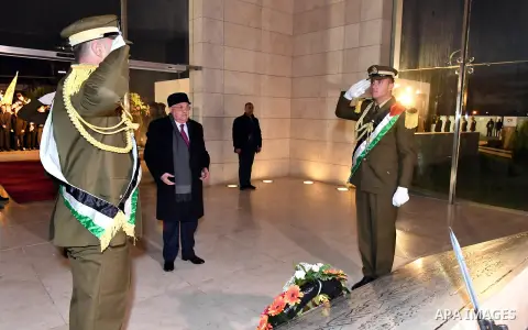 Palestinian president Mahmud Abbas looks on after laying wreath of flowers on the tomb of the late President Yasser Arafat during a celebration marking the fifty-third anniversary of the creation of the Fatah movement in...