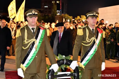 Palestinian president Mahmud Abbas looks on after laying wreath of flowers on the tomb of the late President Yasser Arafat during a celebration marking the fifty-third anniversary of the creation of the Fatah movement in...