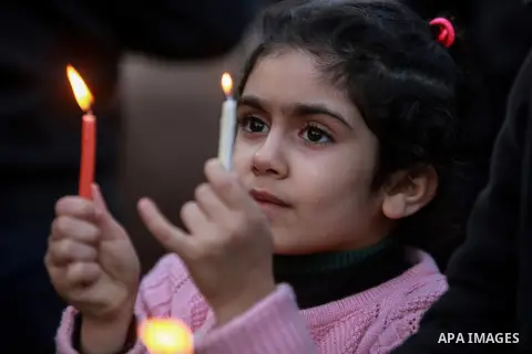 A Palestinian girl holds a candle during a protest in support of Palestinian teenager Ahed Tamimi, 16-year-old in Gaza city on January 8, 2018. Israel charged Tamimi with 12 counts including assault on January 1 followin...