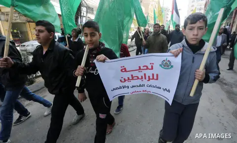 Palestinians hold national flags during a protest against U.S. President Donald Trump's decision to recognise Jerusalem as the capital of Israel, in Gaza city on January 9, 2018. Photo by Mohammed Asad