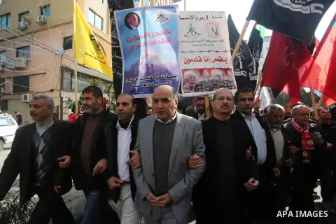Palestinians hold national flags during a protest against U.S. President Donald Trump's decision to recognise Jerusalem as the capital of Israel, in Gaza city on January 9, 2018. Photo by Mohammed Asad
