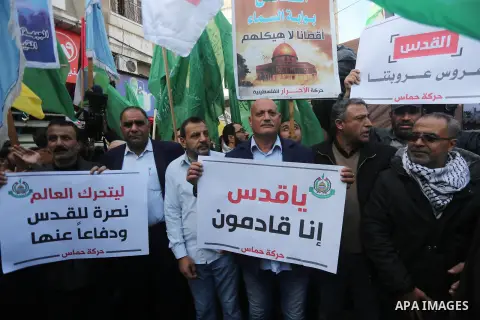 Palestinians hold national flags during a protest against U.S. President Donald Trump's decision to recognise Jerusalem as the capital of Israel, in Gaza city on January 9, 2018. Photo by Mohammed Asad
