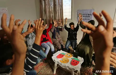 Palestinian children take a yoga lesson which organized by the center for Mind- Body Medicine, in Gaza city on January 10, 2018. The Center for Mind-Body Medicine is a non- profit, educational organization founded in Was...