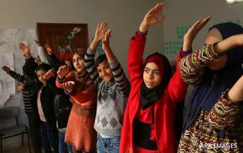 Palestinian children take a yoga lesson which organized by the center for Mind- Body Medicine, in Gaza city on January 10, 2018. The Center for Mind-Body Medicine is a non- profit, educational organization founded in Was...