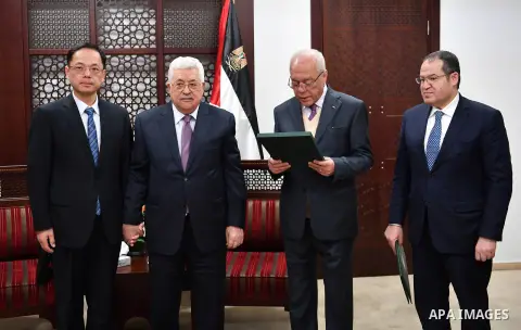 Palestinian President, Mahmoud Abbas, meets with Chinese Ambassador to Palestine, Chen Zhong Xing, in the West Bank city of Ramallah, on January 14, 2018. Photo by Osama Falah