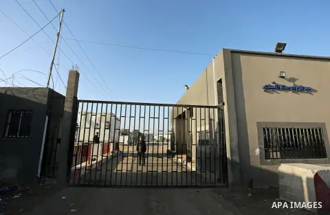 Palestinian security men stand outside Kerem Shalom, the main passage point for goods entering Gaza, after it was shut down by Israel, following the discovery of smuggling tunnels underneath the crossing, in the southern...