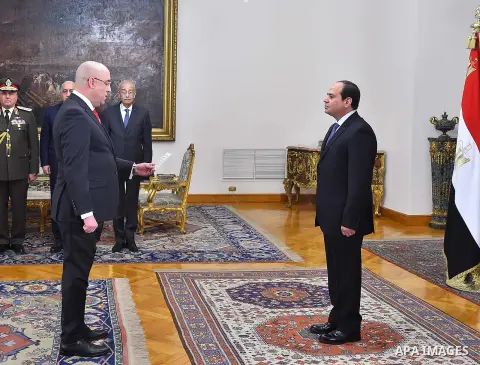Egyptian President Abdel-Fattah el-Sissi, right, listens to the new ministers during a swearing-in ceremony for new cabinet ministers, in Cairo, Egypt, on January 14, 2018. Photo by Egyptian President Office