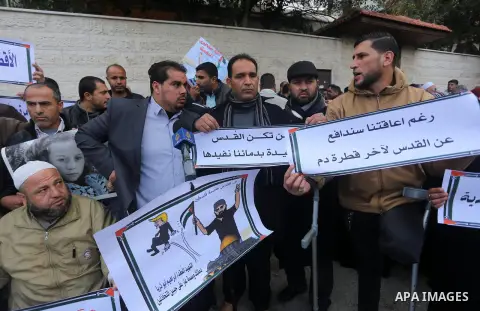 Palestinians take part in a protest against the US president's decision to recognise Jerusalem as the capital of Israel in front of Red Cross office, in Gaza city on January 15, 2018. Photo by Mohammed Asad