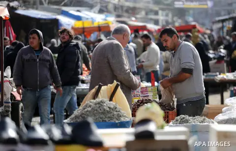 Palestinians shop at a market in Gaza city on January 23, 2018. A general commercial strike has hit the Gaza Strip to protest over worsening economic conditions and the decade-long Israeli blockade, amid warnings of an i...