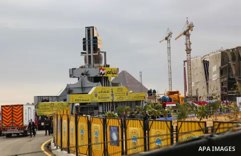 The 3,200-year-old colossal statue of King Ramses II is seen during its transfer to the main entrance of the Grand Egyptian Museum in Cairo's twin city Giza on January 25, 2018. Photo by Amr Sayed