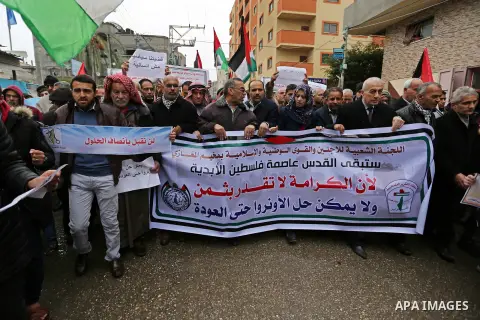Palestinians take part during a protest against US President Donald Trump's decision to recognise Jerusalem as the capital of Israel and froze tens of millions of dollars in contributions to the United Nations Relief and...