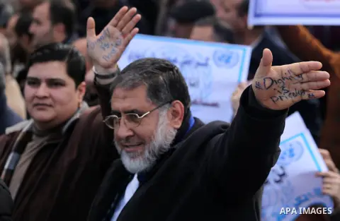 Palestinian employee of United Nations Relief and Works Agency (UNRWA) hold a sign during a protest against a U.S. decision to cut aid, in Gaza City January 29, 2018. Photo by Ashraf Amra