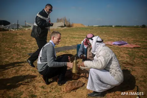 Guislain Defurne, Head of the International Committee of the Red Cross (ICRC) sub-delegation in Gaza drinks coffee during a tour by the International Committee of the Red Cross (ICRC), near the border with Israel, in Raf...