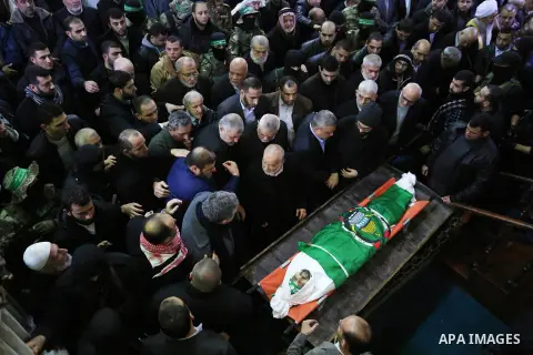 Palestinians mourn over the body of Hamas senior leader Imad al-Alami during his funeral at the al-Omari mosque in Gaza City on January 30, 2018. A senior Hamas official has died in Gaza three weeks after shooting himsel...