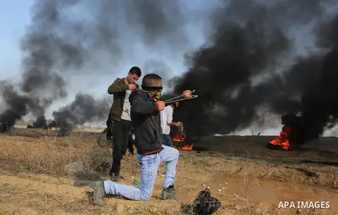 Palestinian protesters clash with Israeli security forces, against US President Donald Trump's decision to recognise Jerusalem as the capital of Israel, near the border with Israel in the southern Gaza Strip on February...