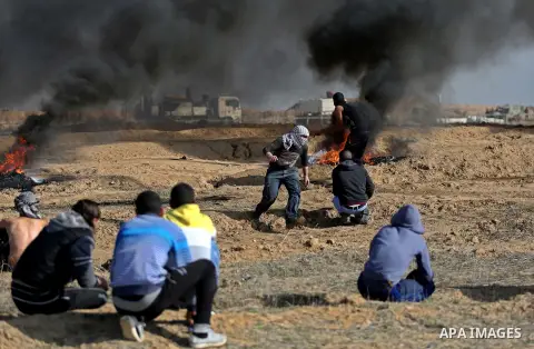 Palestinian protesters clash with Israeli security forces, against US President Donald Trump's decision to recognise Jerusalem as the capital of Israel, near the border with Israel in the southern Gaza Strip on February...