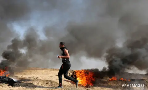 Palestinian protesters clash with Israeli security forces, against US President Donald Trump's decision to recognise Jerusalem as the capital of Israel, near the border with Israel in the southern Gaza Strip on February...