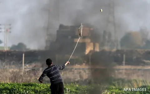 Palestinian protesters clash with Israeli security forces near the border with Israel, east of Gaza City on February 2, 2018 as demonstrations continue over the US president's controversial recognition of Jerusalem as Is...