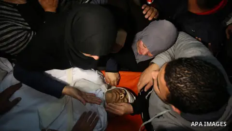 Relatives of Palestinian Ahmed Abu Obeid, 19, who was shot dead during clashes with Israeli security foces mourn over his body at a hospital morgue, in the West Bank city of Jenin, on February. 03, 2018. Photo by Shadi J...