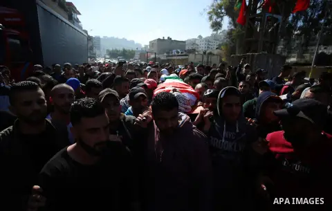 Mourners carry the body of Palestinian Ahmed Abu Obeid, 19, who was shot dead during clashes with Israeli security foces during his funeral, in the West Bank city of Jenin, on February 4, 2018. Photo by Shadi Jarar'ah