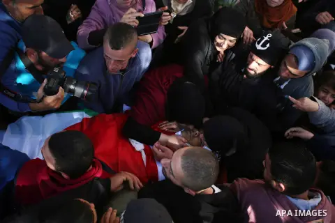 Relatives of Palestinian Ahmed Abu Obeid, 19, who was shot dead during clashes with Israeli security foces mourn during his funeral, in the West Bank city of Jenin, on February 4, 2018. Photo by Shadi Jarar'ah