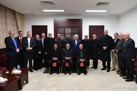 Palestinian President Mahmoud Abbas meets with the monks of the Egyptian Coptic Catholic Church, at his headquarter in the West Bank city of Ramallah on February 5, 2018. Photo by Thaer Ganaim