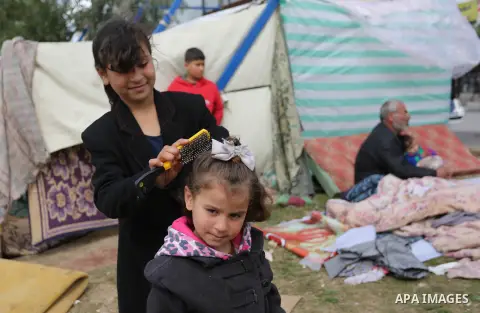 Palestinian Fadel al-Deree and his family gathering around their tent in the middle of Gaza City, on February 13, 2017. The 55-year-old Fadel, his wife and their eight children left their apartment, where they lived for...